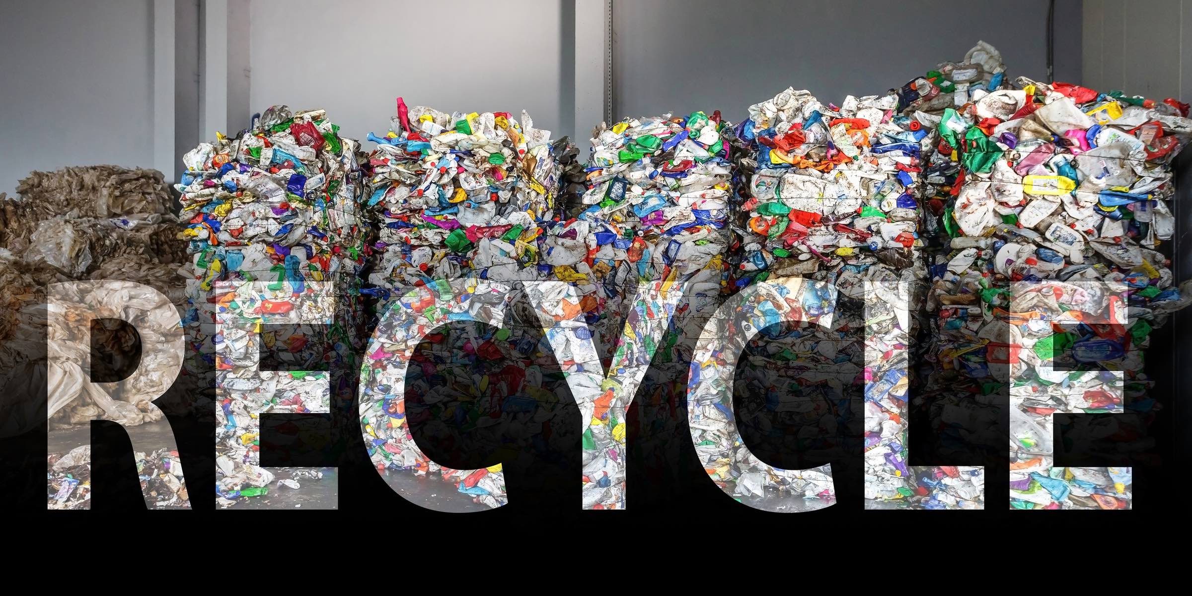 plastic recycling bales with the word recycling over it